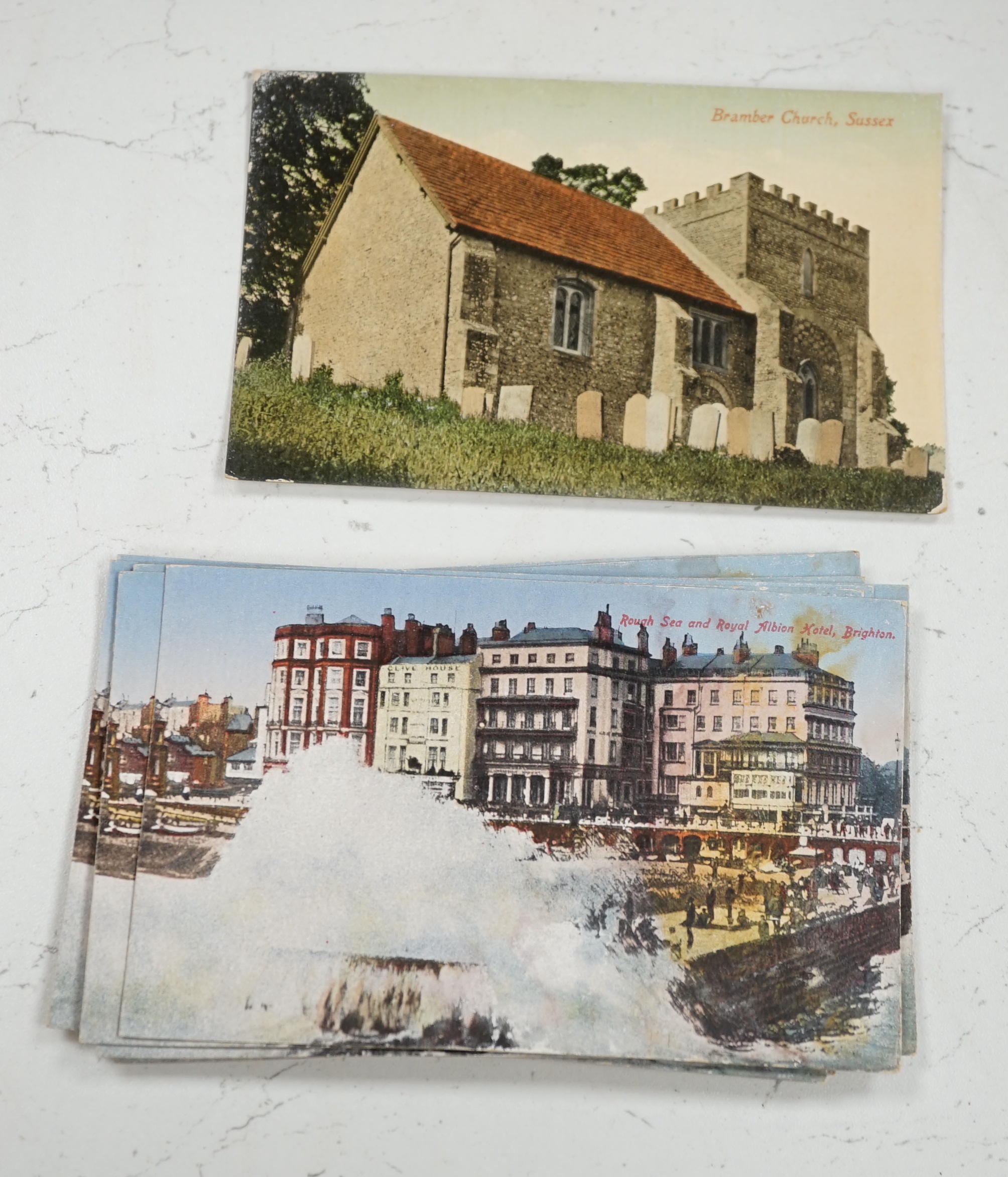 A collection of early 20th century Brighton and Hove related postcards, ex-shop stock with some still in trade boxes, multiple duplicates of the same postcard, including some from the Brighton Palace series, some publish